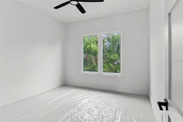 a view of an empty room and closet area