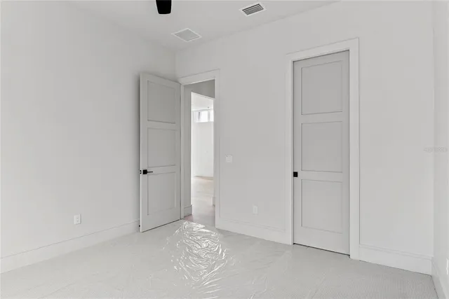 a kitchen with stainless steel appliances white cabinets and a sink