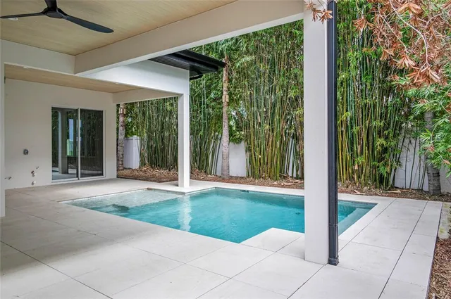 a view of a house with backyard porch and porch