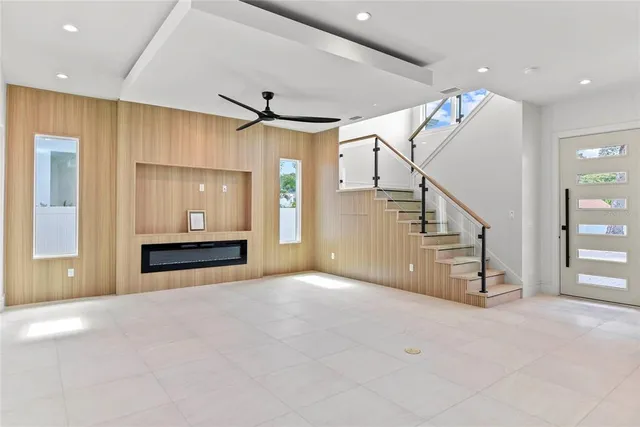 en view interior of a house with stairs and a ceiling fan