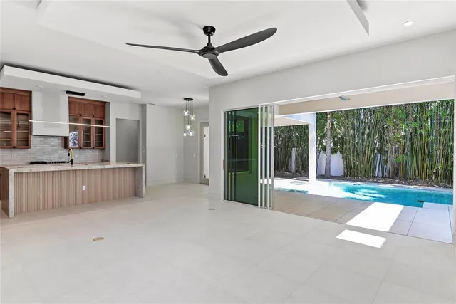 a view of a livingroom with furniture staircase and front door