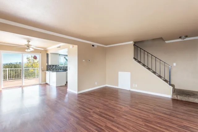 a view of an entryway with wooden floor