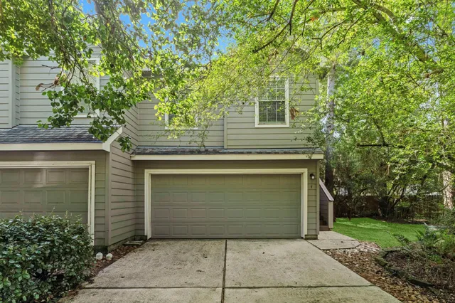 a front view of a house with garage
