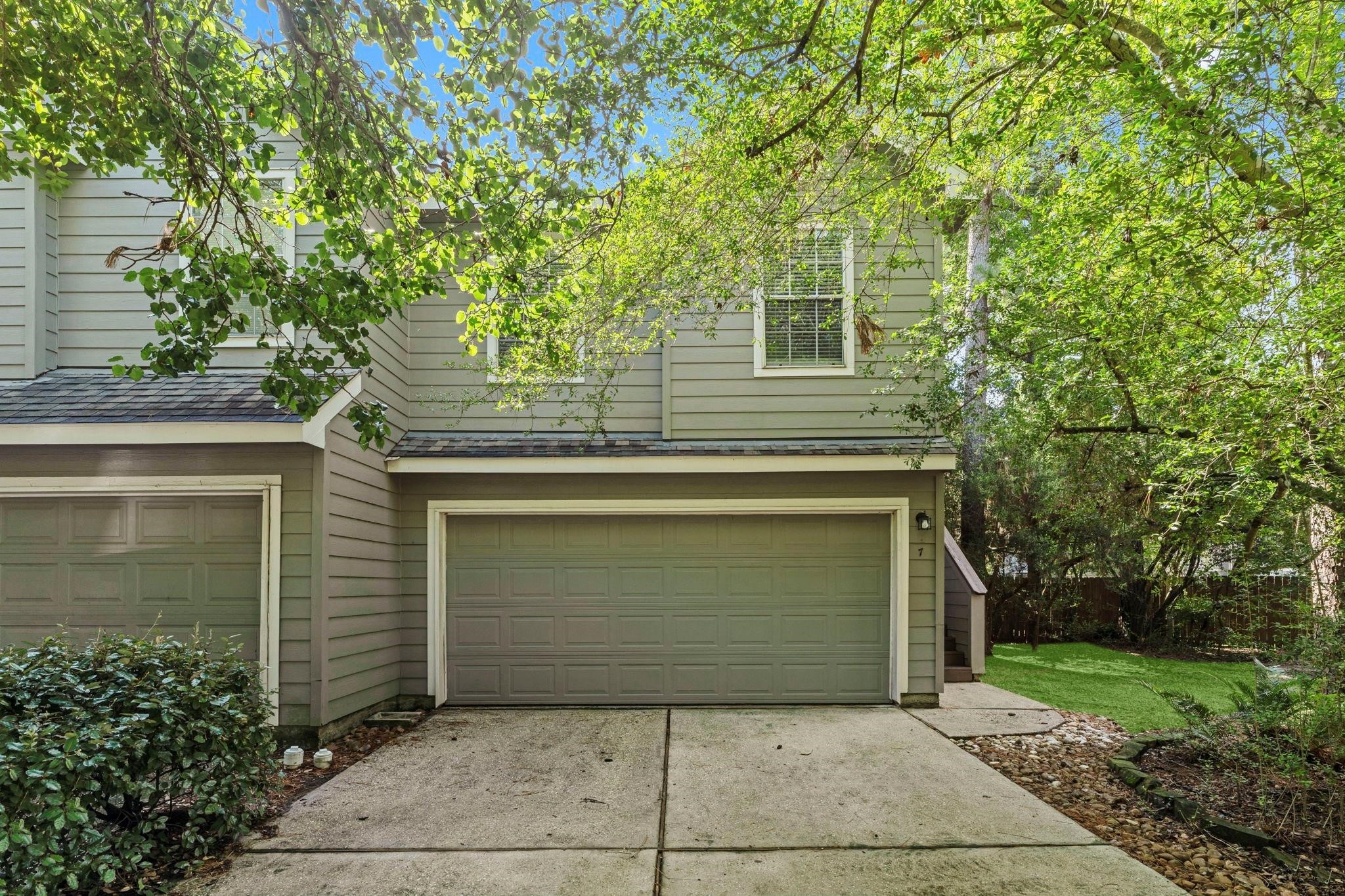 7 Verbena Bend Place Spring, TX 77382 - Photo 1 of 33 a front view of a house with garage