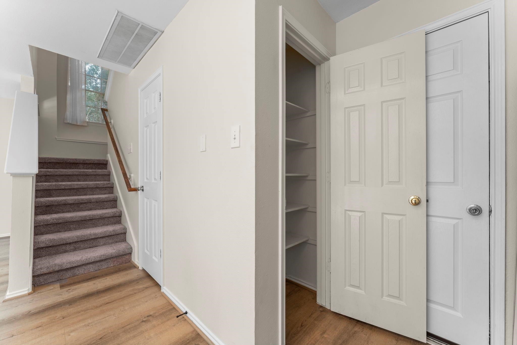 7 Verbena Bend Place Spring, TX 77382 - Photo 11 of 33 a view of a hallway with wooden floor and entryway