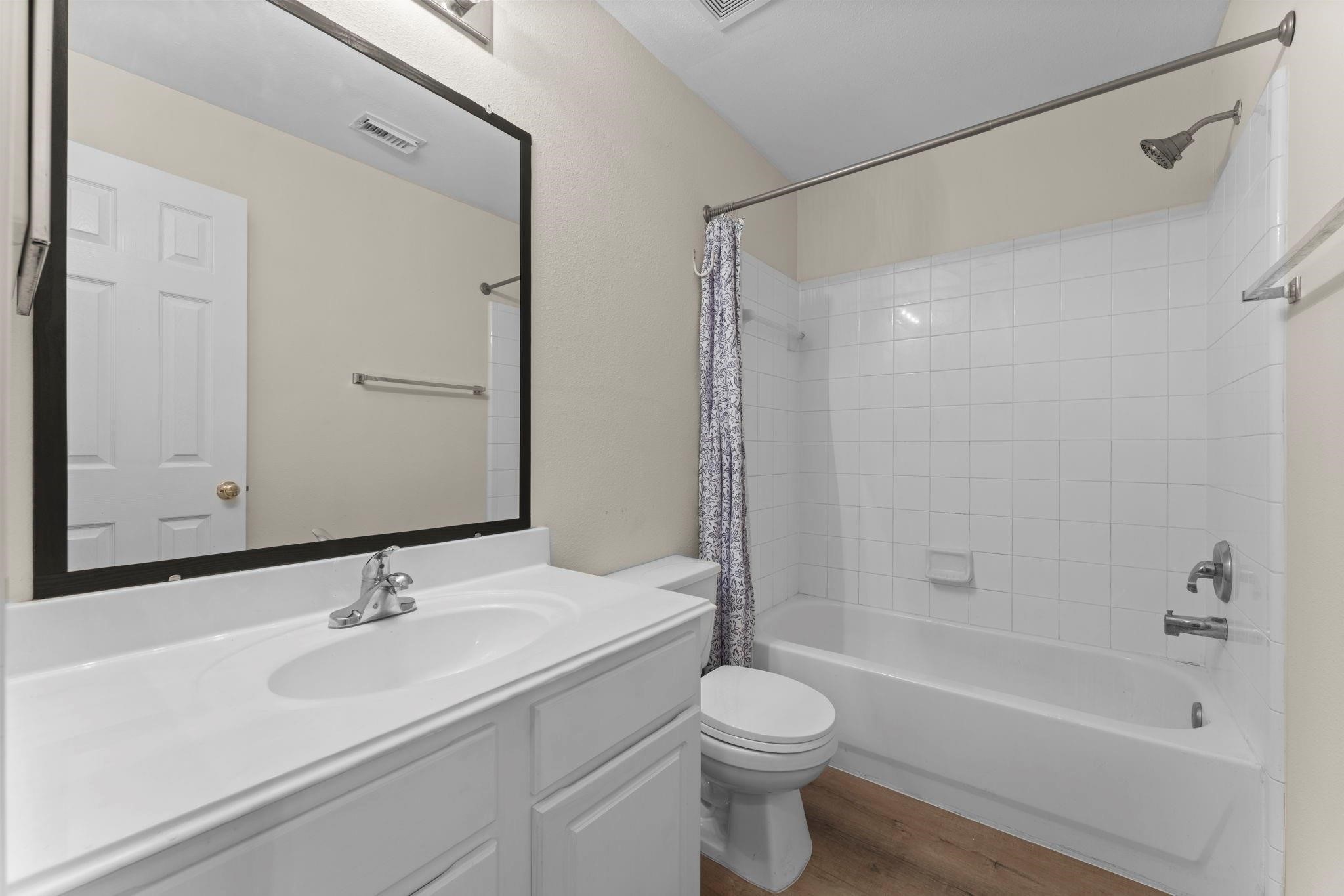 7 Verbena Bend Place Spring, TX 77382 - Photo 18 of 33 a bathroom with a sink toilet and shower