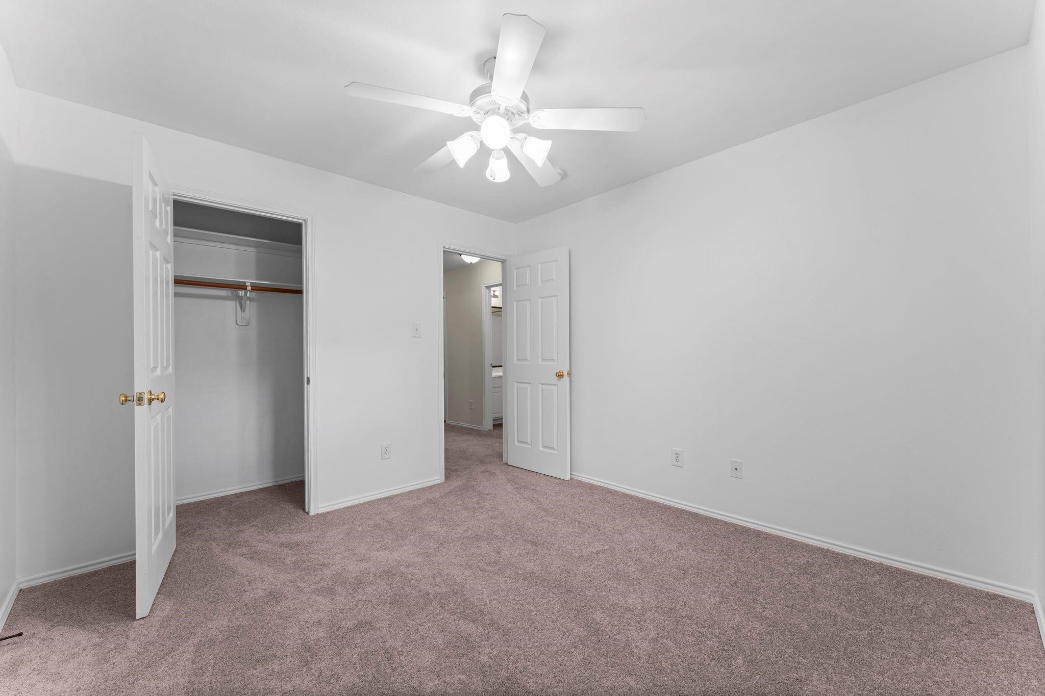 7 Verbena Bend Place Spring, TX 77382 - Photo 22 of 33 a view of an empty room with a ceiling fan