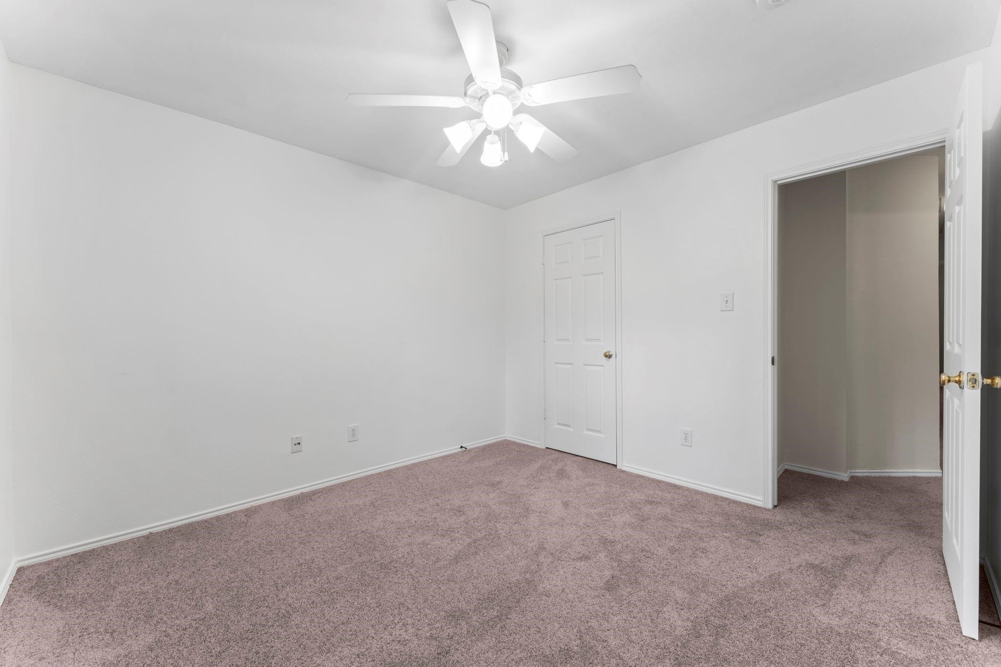 7 Verbena Bend Place Spring, TX 77382 - Photo 23 of 33 an empty room with a chandelier fan and windows