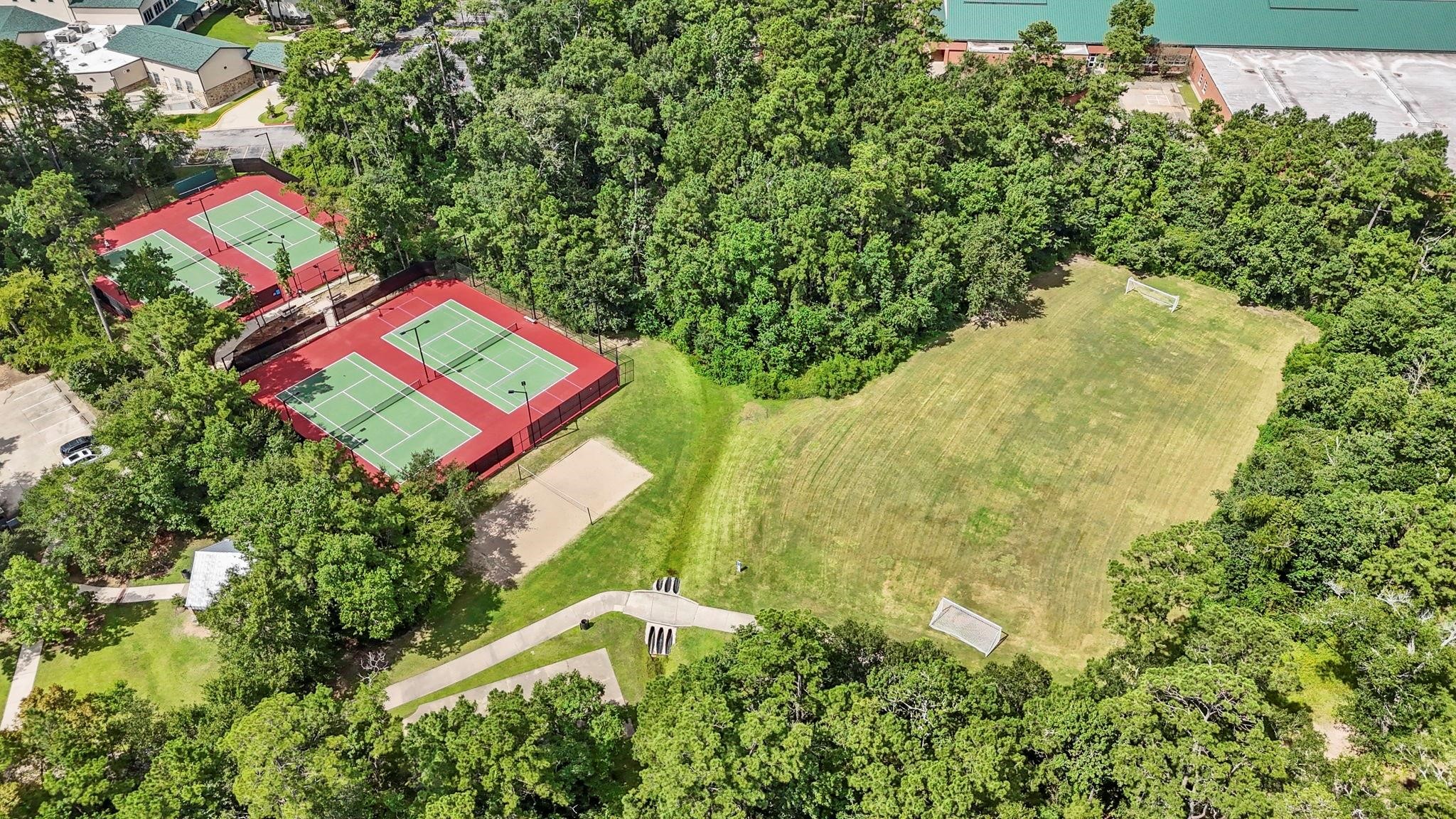 7 Verbena Bend Place Spring, TX 77382 - Photo 31 of 33 a view of a yard with plants and wooden fence