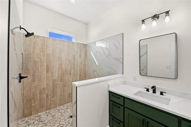 a bathroom with a double vanity sink and mirror