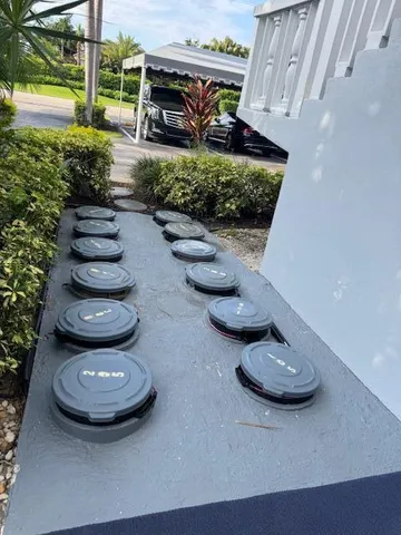 a view of a backyard with table and chairs