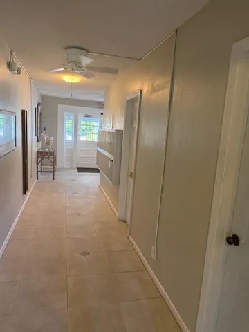 a view of hallway with livingroom