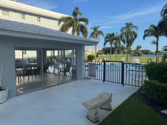 a view of a patio with a backyard