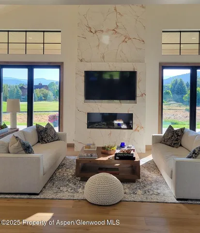 a bedroom with a bed and large window