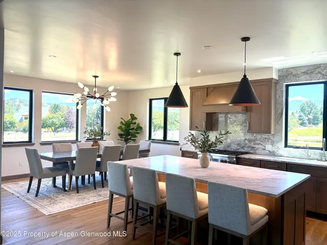 a bathroom with double vanity sinks and a mirror