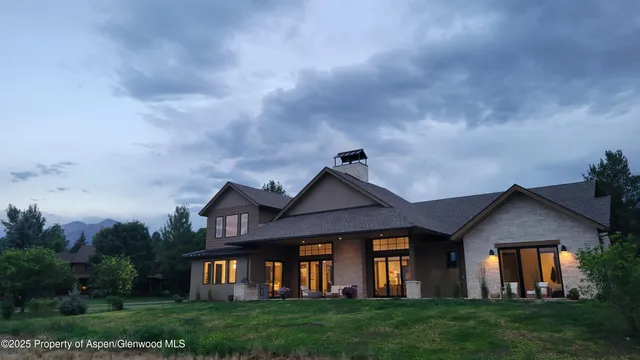 a front view of house with a garden