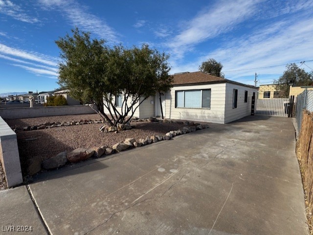 132 West Victory Road Henderson, NV 89015 - Photo 2 of 28 Large driveway with RV gate and parking.