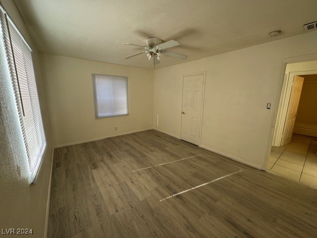 132 West Victory Road Henderson, NV 89015 - Photo 23 of 28 Second bedroom with walk in closet and ceiling fan.
