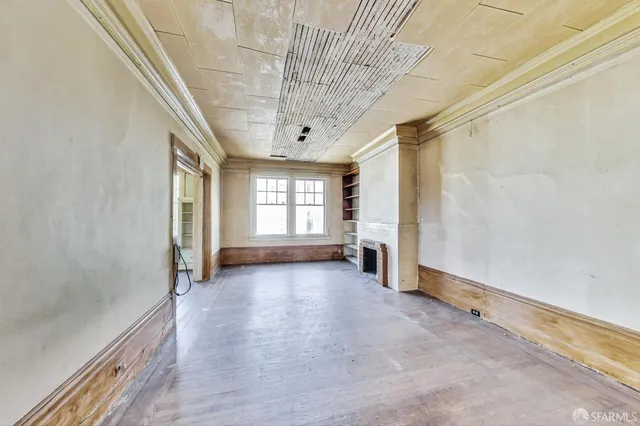 a view of a room with a large window