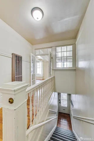 a view of a balcony and wooden floor