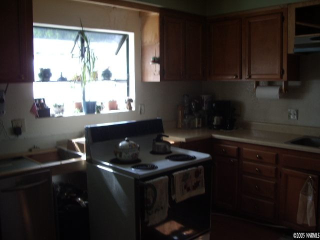 3872 West 7th Street Reno, NV 89503 - Photo 5 of 9 a kitchen with a sink cabinets and window