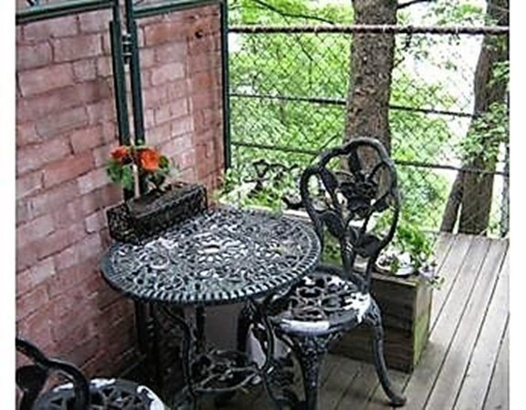 147 Winthrop Road, Unit 2 Brookline, MA 02445 - Photo 10 of 19 a table with a vase of flowers sitting on a table