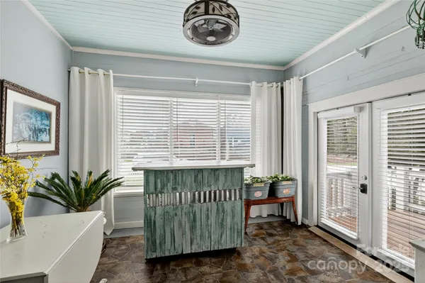 a dining room with a table and chairs