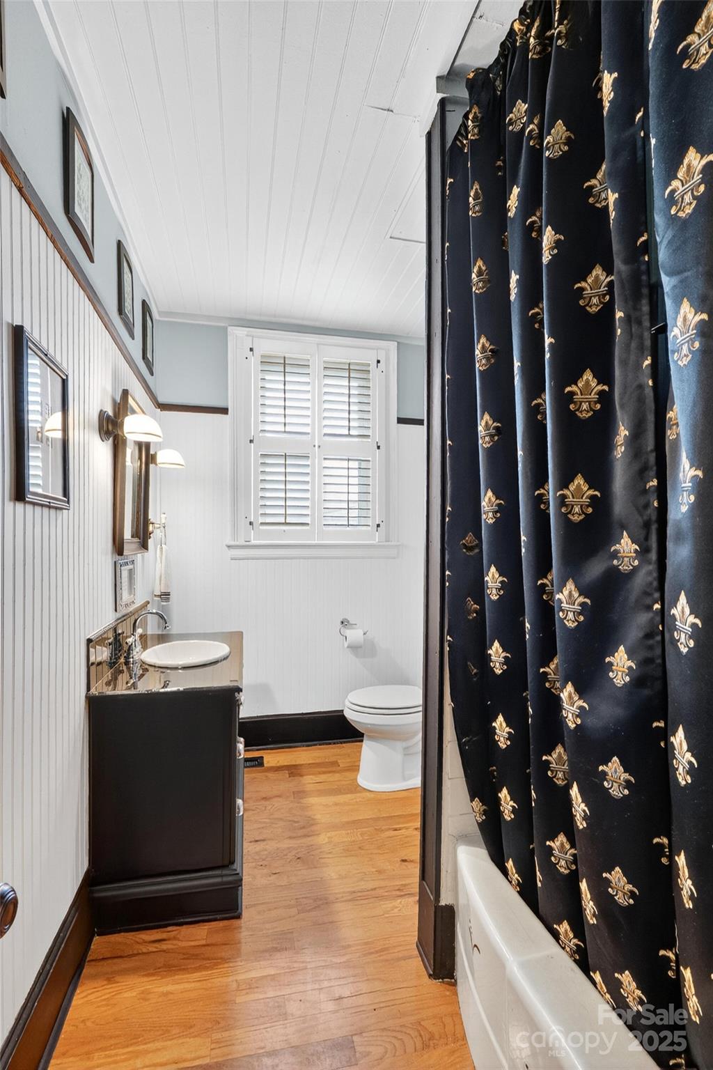 178 South Caldwell Street Brevard, NC 28712 - Photo 19 of 40 walk in closet with window and wooden floor