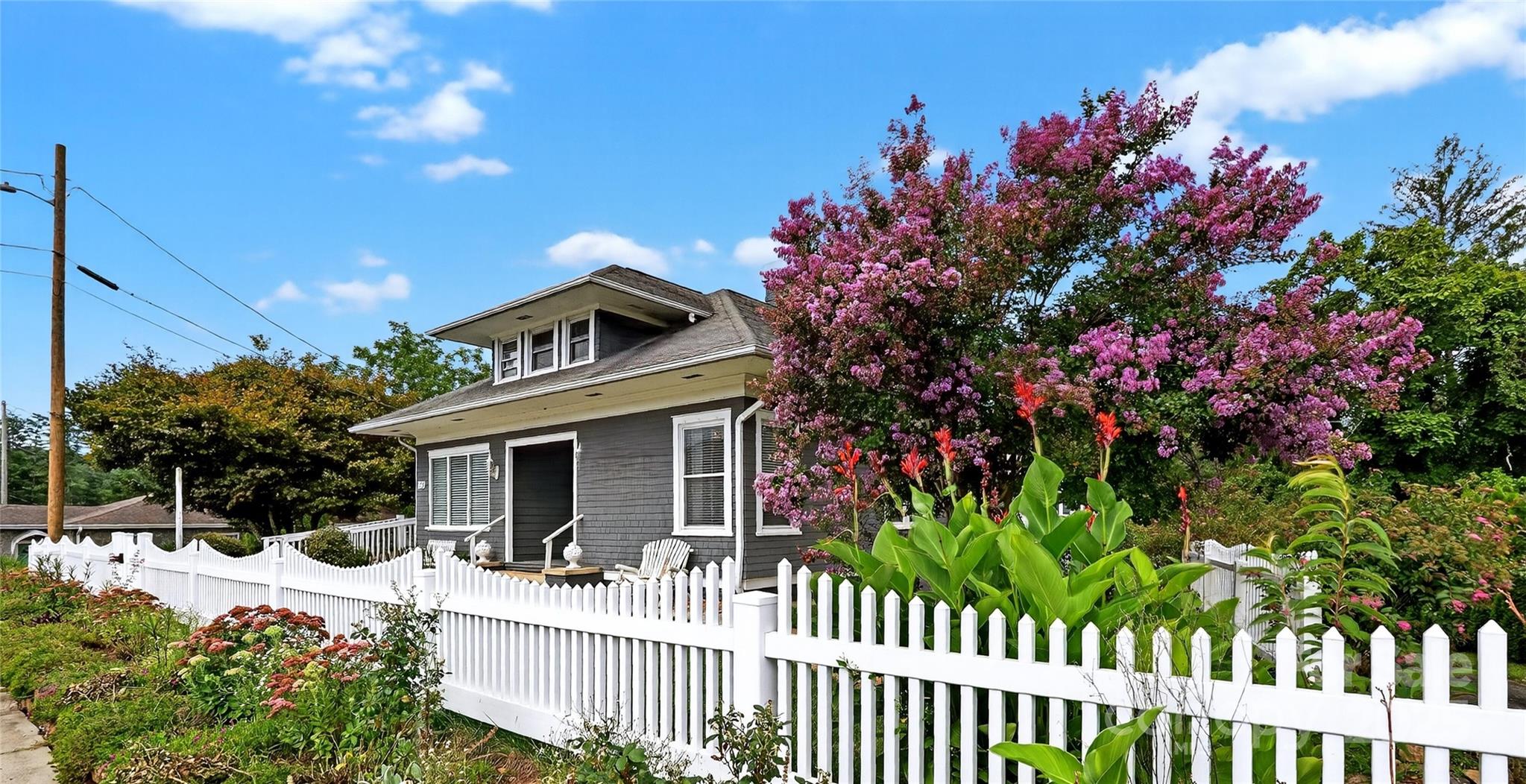 178 South Caldwell Street Brevard, NC 28712 - Photo 2 of 40 a front view of a house with a yard
