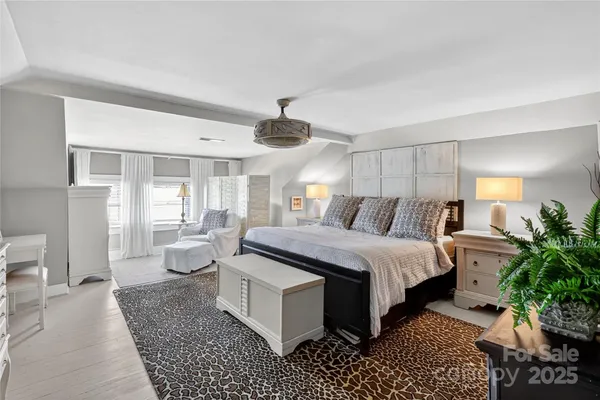 a bed room with furniture and a window