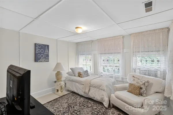 a bathroom with a sink a mirror and a window