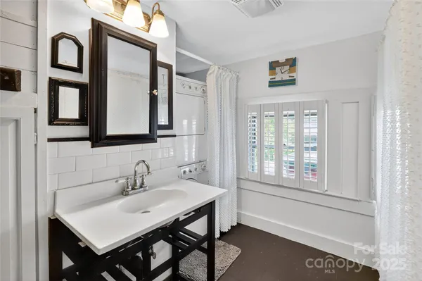 a picture of a bathroom with a window