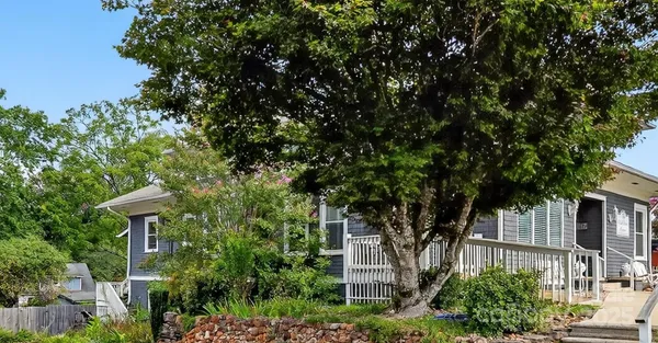 a view of a house with a tree