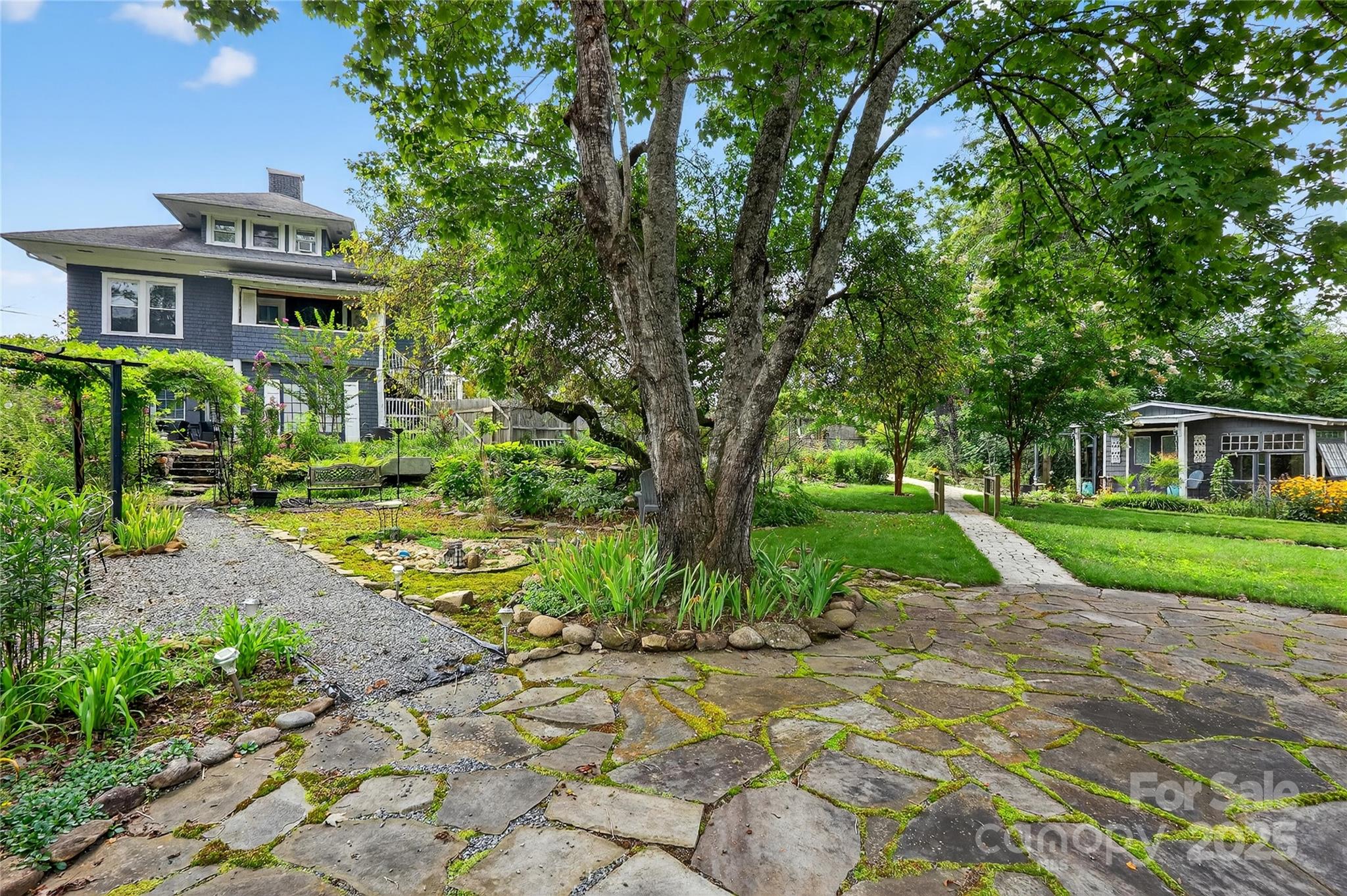 178 South Caldwell Street Brevard, NC 28712 - Photo 38 of 40 a view of a house with a yard
