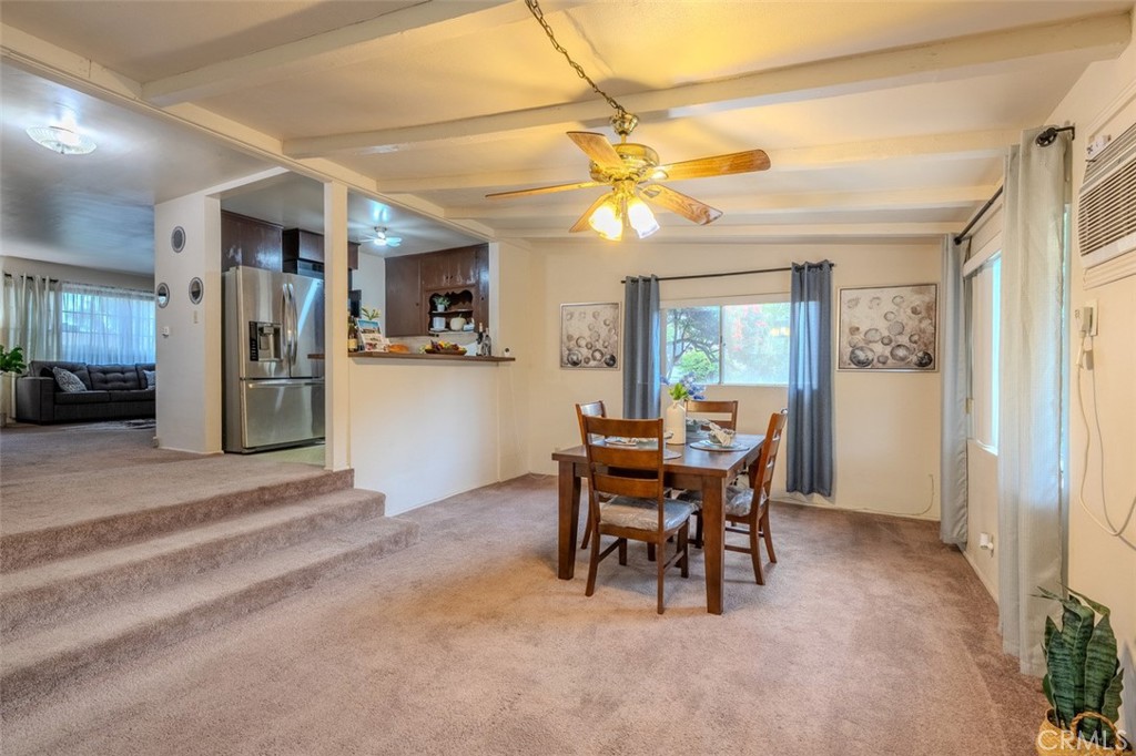 7859 Sycamore Avenue Riverside, CA 92504 - Photo 13 of 31 a view of a dining room with furniture and a chandelier