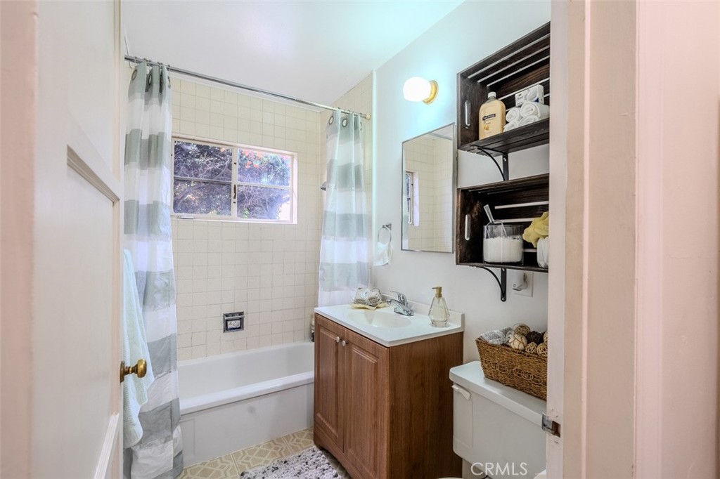 7859 Sycamore Avenue Riverside, CA 92504 - Photo 21 of 31 a bathroom with a sink toilet and shower