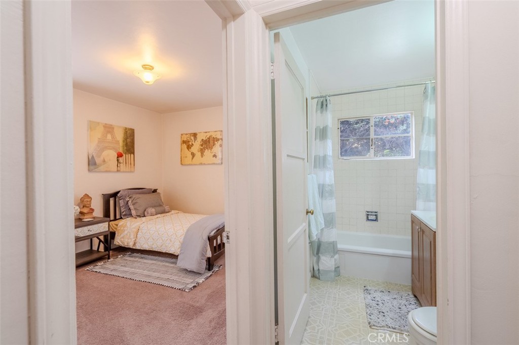 7859 Sycamore Avenue Riverside, CA 92504 - Photo 22 of 31 a en suite bathroom with a toilet sink and a shower