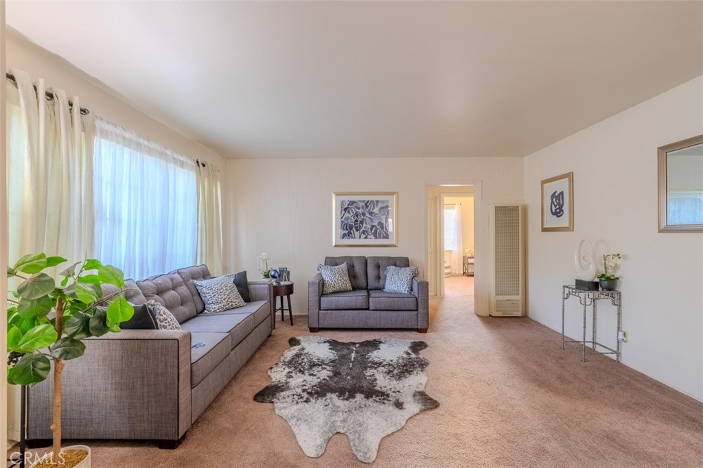 7859 Sycamore Avenue Riverside, CA 92504 - Photo 6 of 31 a living room with furniture and a potted plant