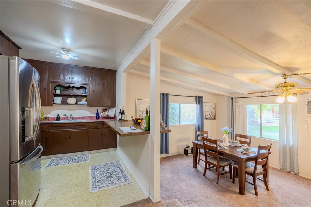 7859 Sycamore Avenue Riverside, CA 92504 - Photo 10 of 31 a kitchen with a dining table and chairs