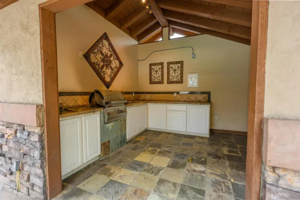 a kitchen with a sink and cabinets