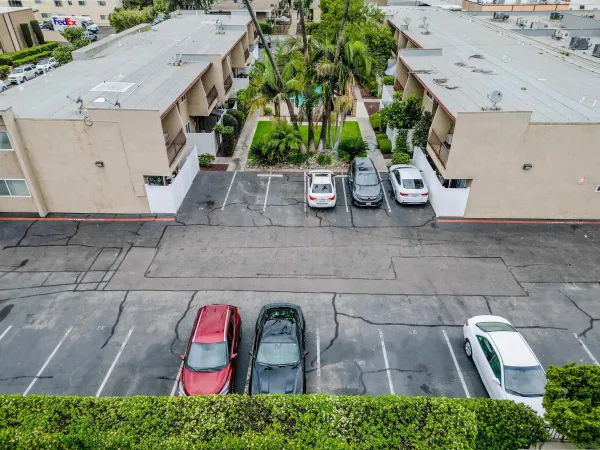 an aerial view of a backyard with plants and outdoor seating
