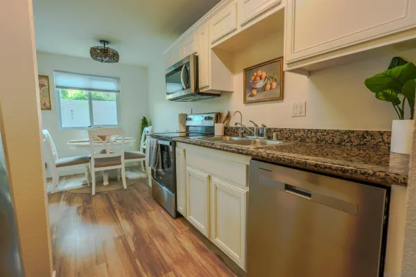 a kitchen with a sink and cabinets