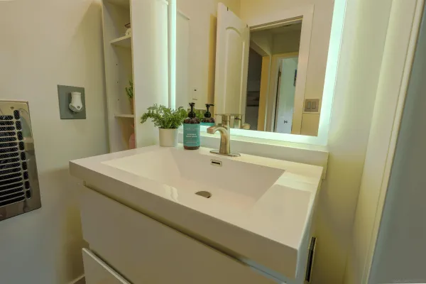 a bathroom with a sink and a mirror