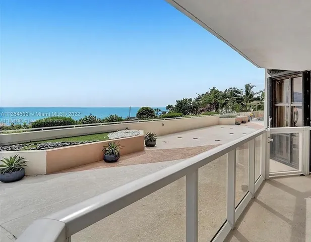 a terrace with outdoor seating and city view