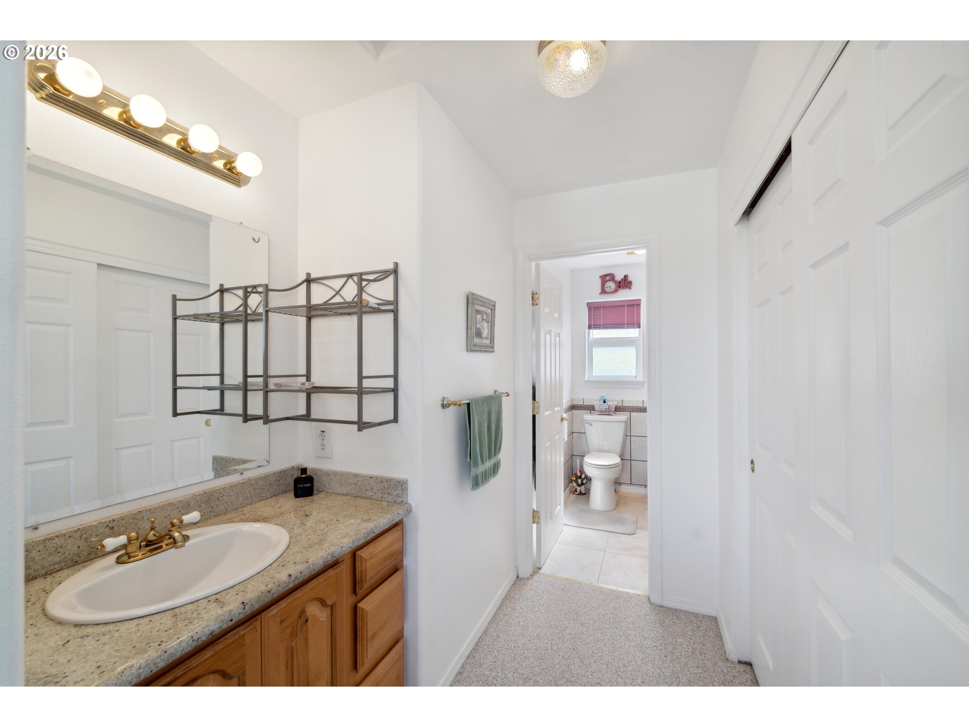 805 Lisa Place Coos Bay, OR 97420 - Photo 15 of 47 a bathroom with a sink and a mirror