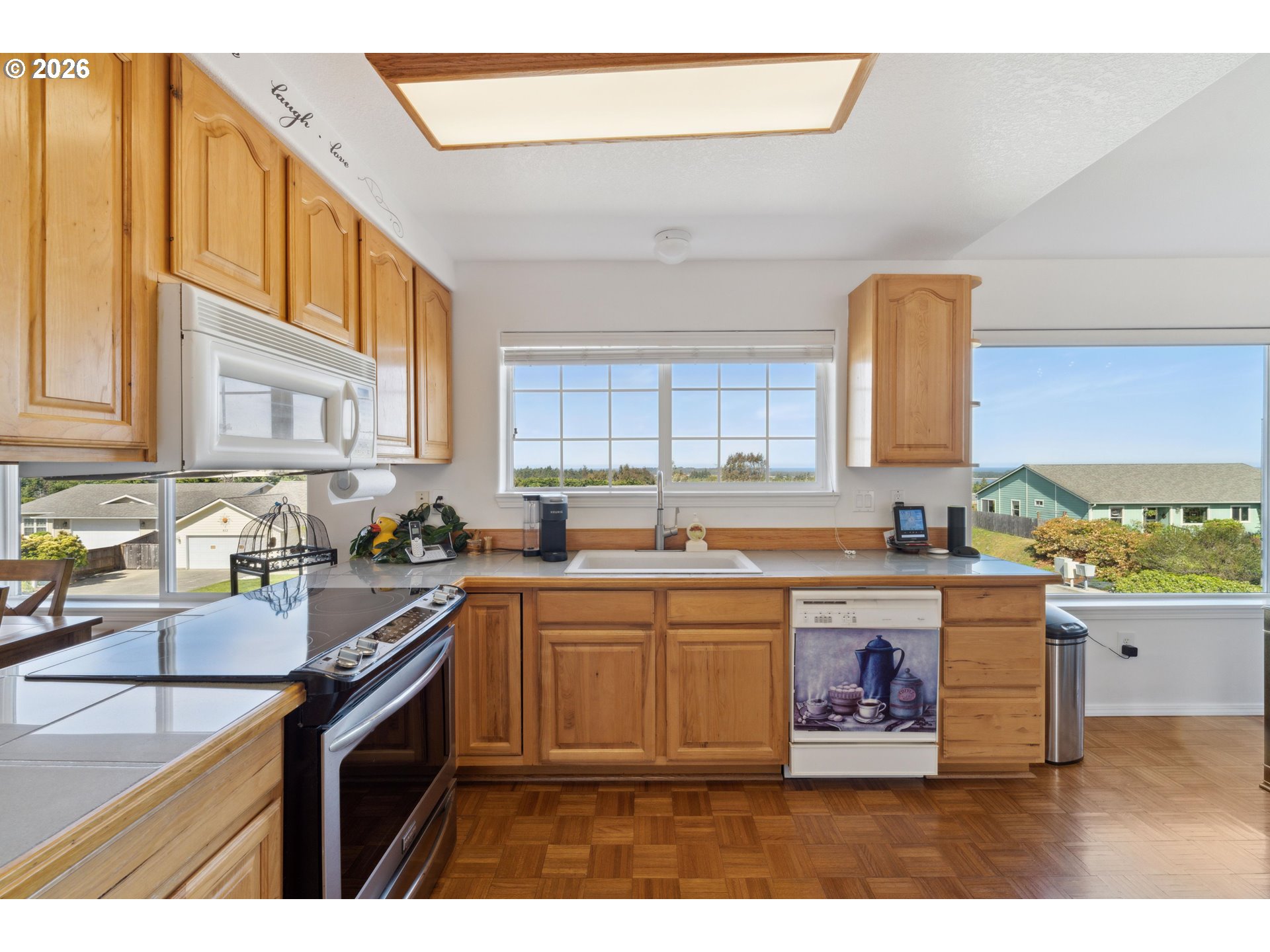 805 Lisa Place Coos Bay, OR 97420 - Photo 20 of 47 a kitchen with a sink a stove and cabinets