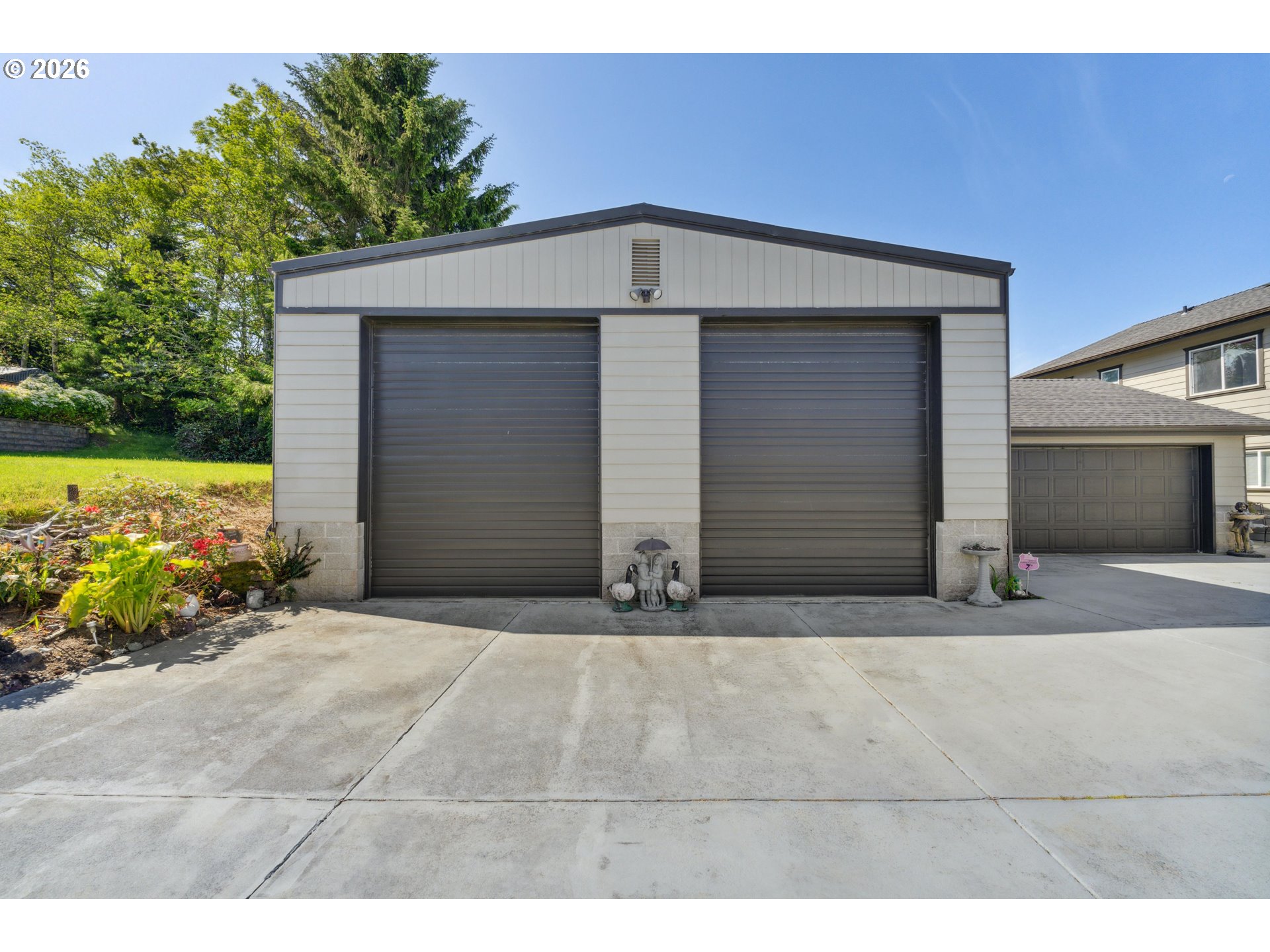 805 Lisa Place Coos Bay, OR 97420 - Photo 29 of 47 a front view of a house with a yard and garage
