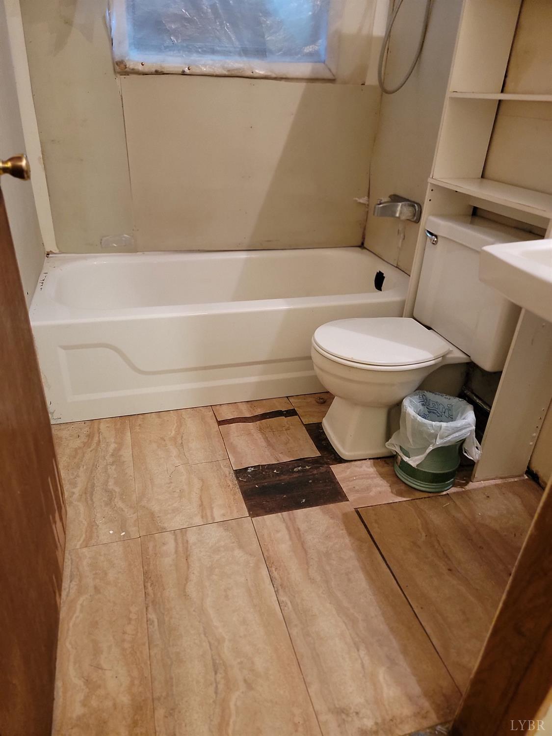 6097 Wards Road Hurt, VA 24563 - Photo 4 of 7 a bathroom with a toilet and a shower