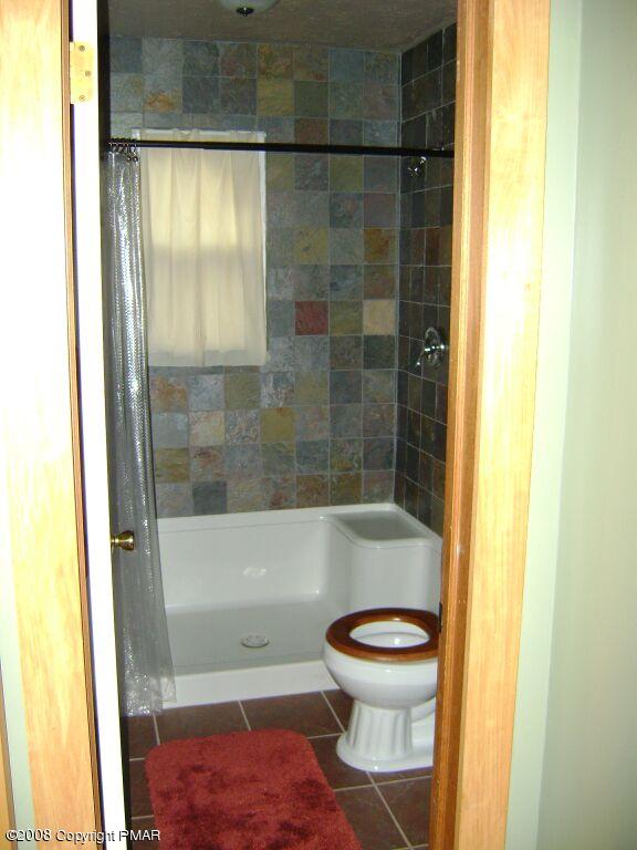 112 Bromley Road Henryville, PA 18332 - Photo 13 of 13 a bathroom with a shower and a toilet