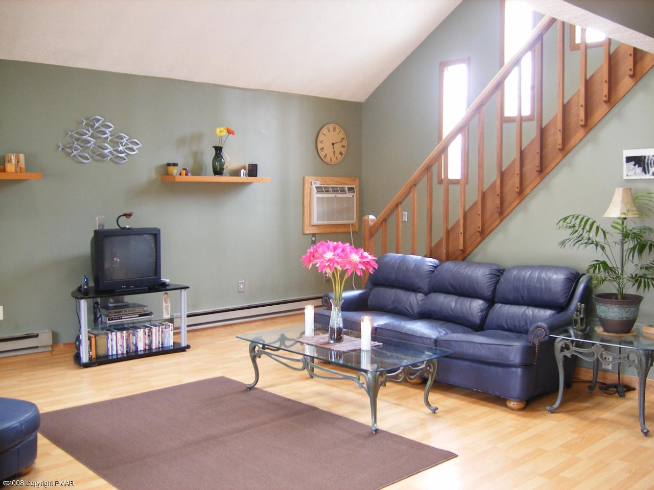 112 Bromley Road Henryville, PA 18332 - Photo 3 of 13 a living room with furniture flowerpot and a chandelier